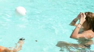 Exotic chick Abella Anderson swimming with a guy in the pool and showing her boobs