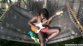 Naked ebony Skyler Nicole playing guitar