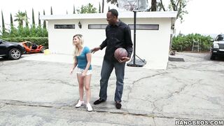 Alex Little plays basketball with a tall black guy