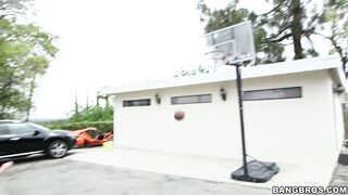 Alex Little plays basketball with a tall black guy