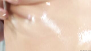 Oiled up blonde Dahlia Sky teases her trimmed pussy close up