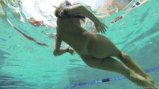 Busty August Ames dives in deep for an underwater tease