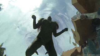 Busty August Ames dives in deep for an underwater tease