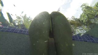 Busty August Ames dives in deep for an underwater tease