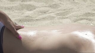 Tattooed blonde Silvana Violet jerking dicks on a beach