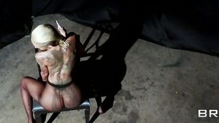 Tattooed porn star Bella Bellz teases oiled up on the floor