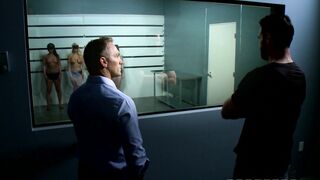 Cassidy Banks and Kenzie Taylor lined up topless in police station