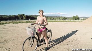 Busty Czech blonde Kathy Anderson riding her bike butt naked