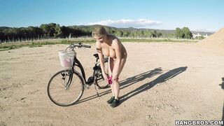 Busty Czech blonde Kathy Anderson riding her bike butt naked