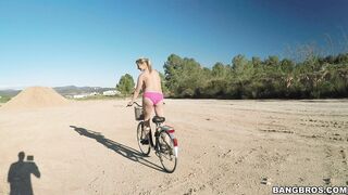 Busty Czech blonde Kathy Anderson riding her bike butt naked