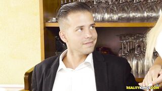 Blondie Fesser is revealing her huge tits in the restaurant