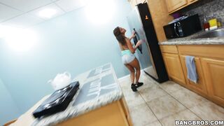 Mia Martinez is resting her tits on the kitchen counter