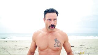 Bridgette B and Nicolette Shea play with each other on the beach