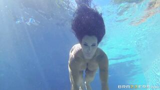 Holly Halston relaxing in the pool