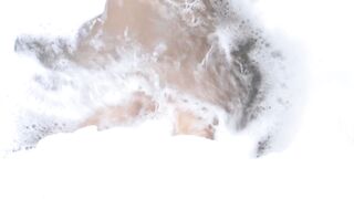 Erica Fontes covers her juicy jugs with foam